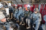 Soldiers aboard a Chinook helicopter prior to taking off on an operation at Fort Hood in September, 2012.