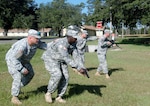 Members on the unit ministry team, 55th Brigade Combat Team, a Pennsylvania National Guard unit, practice flanking movements during their pre deployment training held at Camp Shelby Joint Force Training Center, Miss.