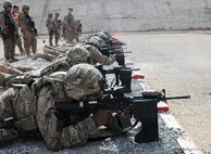 Sgt. Lamont Scott, of Waipahu, Hawaii, foreground, confirms his M-4 rifle's accuracy along with several dozen additional Soldiers from the Hawaii Army Guard's 29th Infantry Brigade Combat Team at Kandahar Airfield's small arms rifle range Nov. 14, 2012.