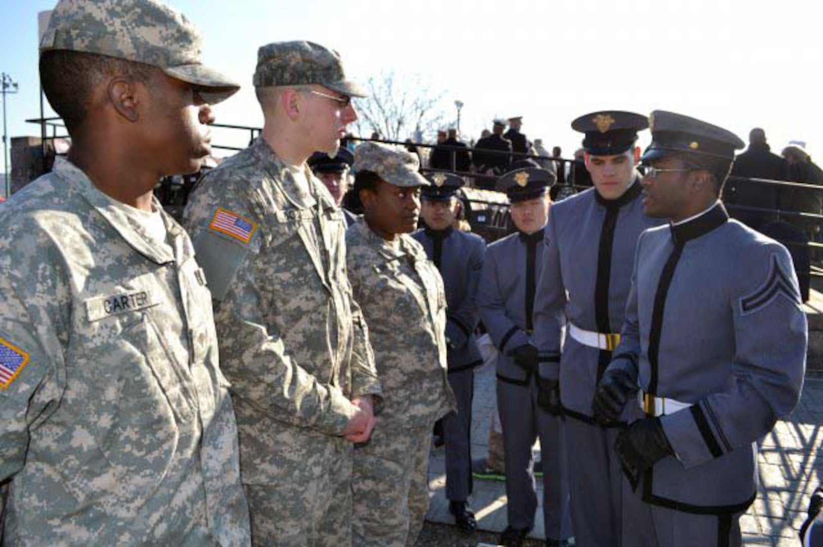 New York Army National Guard Spc. Naseer Carter, Pfc. Douglas Dolan and Pvt. Rebecca Rousseau listen to West Point Cadet Sgt. Jordan Lee of Queens, N.Y., as he explains his experiences at the academy.