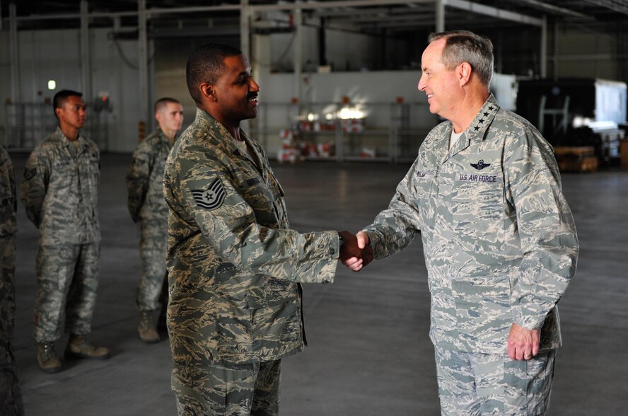 Air Force Chief of Staff Mark A. Welsh III greets Airmen from the 730th Air Mobility Squadron Aug. 27, 2013, during his visit to Yokota Air Base, Japan. As part of his first visit to the region as Air Force chief of staff, Welsh met with Airmen and addressed the Air Force's unique challenges and opportunities in the Asia-Pacific theater. (U.S. Air Force photo/Senior Airman Cody H. Ramirez)