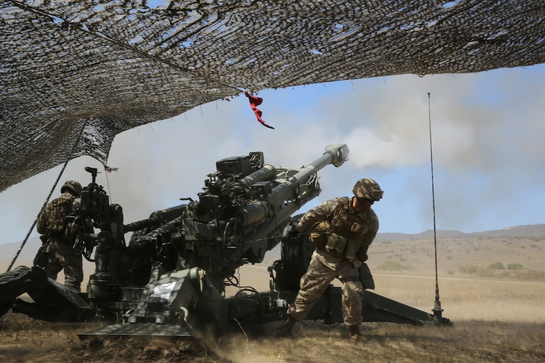 Corporal Parker Thorndike, field artillery cannoneer, India Battery, 1st Battalion, 11th Marine Regiment, fires an M777 Lightweight Howitzer during an annual, live-fire training exercise here, Aug. 21, 2013.  Marines with the entire regiment conducted the live-fire training exercise from Aug. 19 through 28.