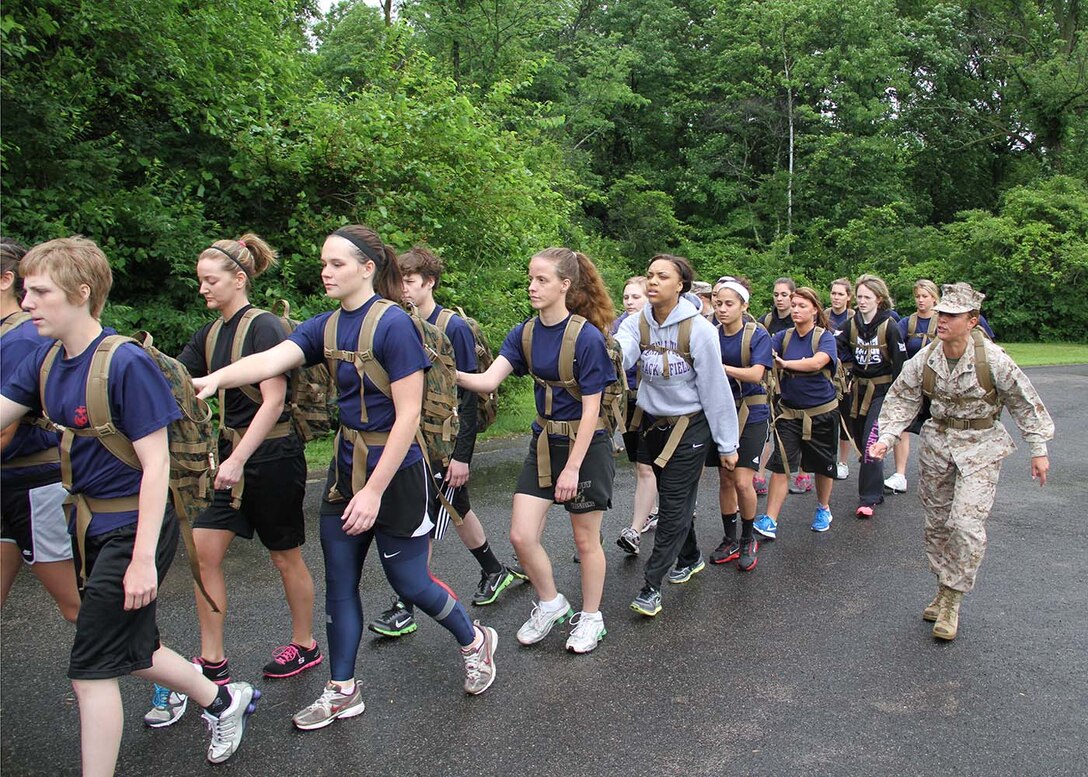 Sgt. Danielle Weldon, drill instructor, 4th Recruit Training Battalion, Marine Corps Recruit Depot Parris Island, S.C., motivates the female poolees of RS Indianapolis during a training hike aboard Fort Harrison State Park, Indianapolis, on June 1.