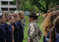 Sgt. Danielle Weldon, drill instructor, 4th Recruit Training Battalion, Marine Corps Recruit Depot Parris Island, S.C., corrects a female poolee from RS Indianapolis after their training hike through Fort Harrison State Park, Indianapolis, on June 1.