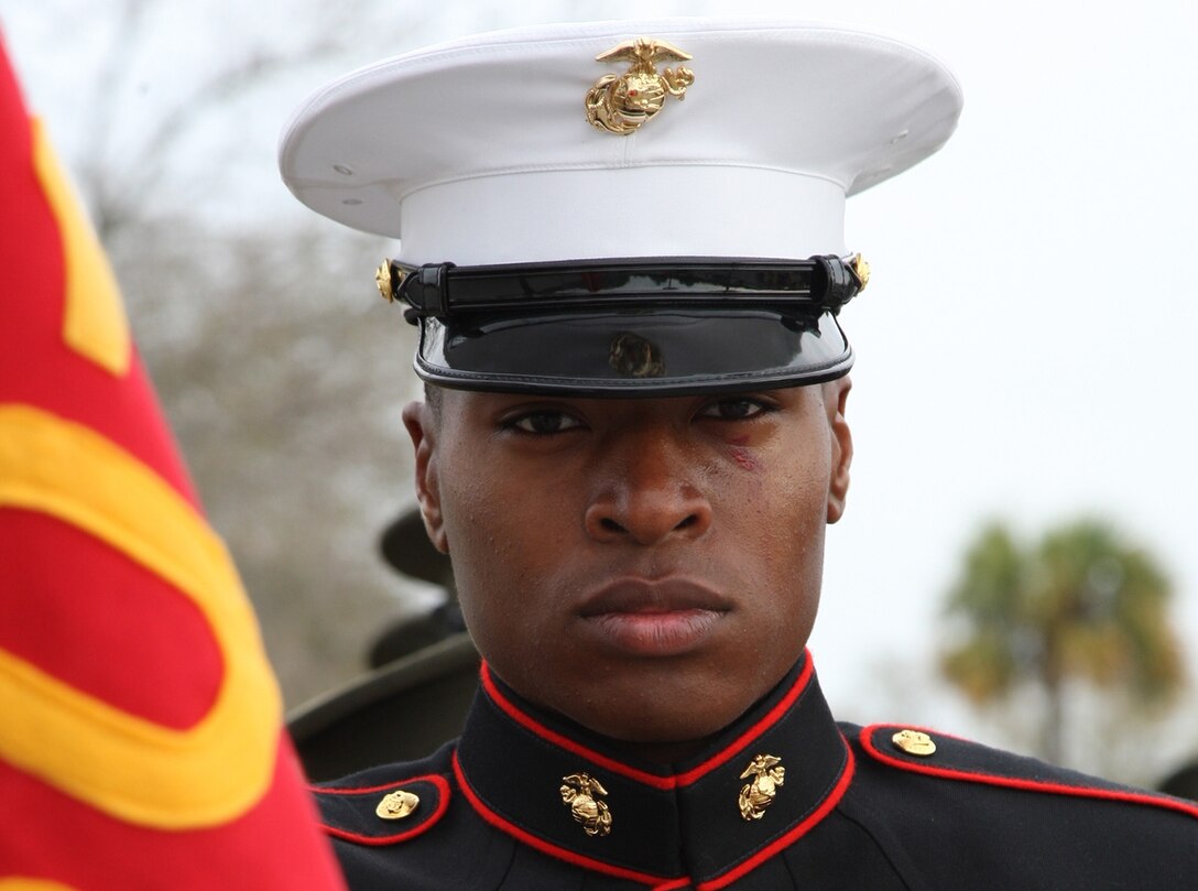 U.S. Marine Corps Pfc. Christopher Otoki, honor graduate, Platoon 3016, Mike Company, 3rd Recruit Training Battalion, Recruit Training Regiment, stands at parade rest before marching onto the Peatross Parade Deck for the Mike and November Company graduation ceremony aboard Marine Corps Recruit Depot Parris Island, S.C., March 9, 2012. Otoki was designated the platoon honor graduate with the highest combined score in physical fitness, rifle qualification and educational scores as well as demonstrating overall leadership traits.