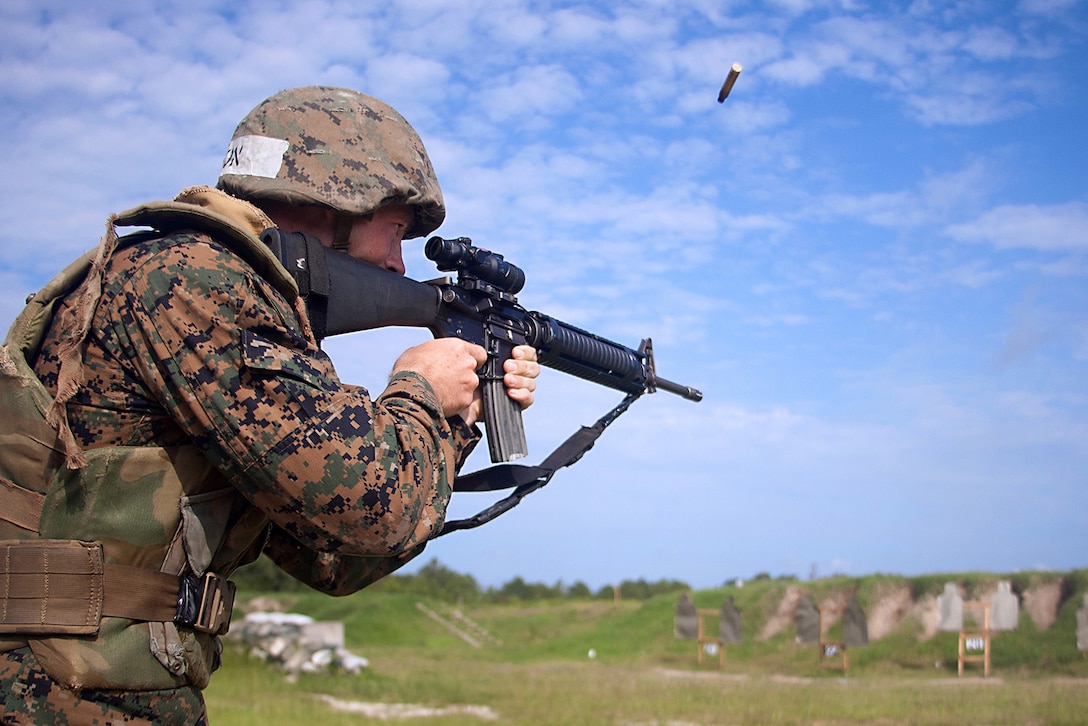 Rct. Drew Wilson, Platoon 1053, Bravo Company, 1st Recruit Training Battalion, fires at his target June 26, 2013, on one of the rifle ranges on Parris Island, S.C. Wilson, a 23-year-old native of Clayton, Del., fired a total of 50 rounds at close-range targets in a series of shooting drills. The objective of marksmanship training is to develop, sustain and improve individual combat shooting skills. Bravo Company is scheduled to graduate July 19, 2013. Parris Island has been the site of Marine Corps recruit training since Nov. 1, 1915. Today, approximately 20,000 recruits come to Parris Island annually for the chance to become United States Marines by enduring 13 weeks of rigorous, transformative training. Parris Island is home to entry-level enlisted training for 50 percent of males and 100 percent for females in the Marine Corps. (Photo by Lance Cpl. MaryAnn Hill)