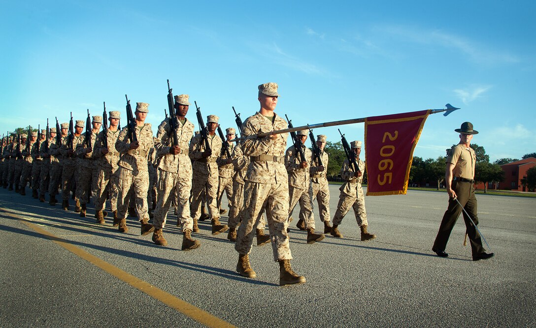 Recruits of Platoon 2065, Golf Company, 2nd Recruit Training Battalion, march in formation at the company’s final drill evaluation Aug. 21, 2013, on Parris Island, S.C. Close-order drill is a key part of Marine Corps recruit training because it develops discipline, confidence, teamwork and respect for authority. Platoon 2065 is led by Sgt. Edward Sortino, 25, grew up on Parris Island. Golf Company is scheduled to graduate Aug. 30, 2013.  Approximately 20,000 recruits come to Parris Island annually for the chance to become United States Marines by enduring 13 weeks of rigorous, transformative training. Parris Island is home to entry-level enlisted training for 50 percent of males and 100 percent for females in the Marine Corps. (Photo by Lance Cpl. David Bessey)

