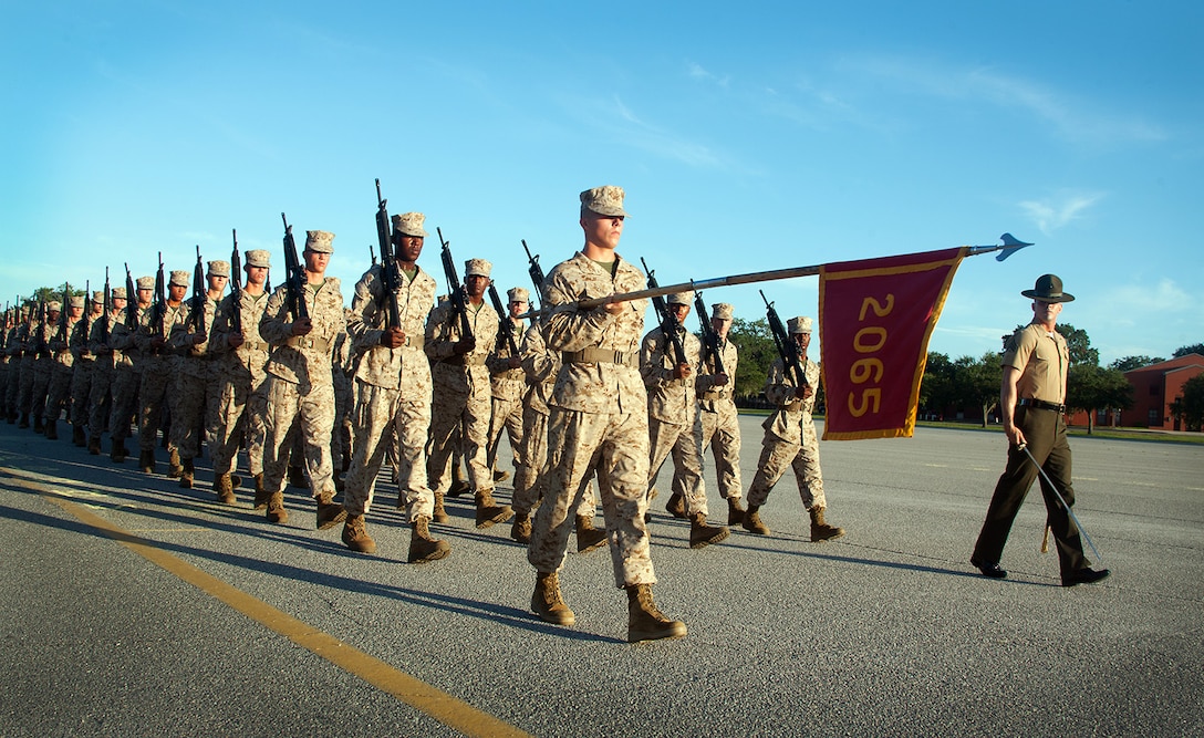 Recruits of Platoon 2065, Golf Company, 2nd Recruit Training Battalion, march in formation at the company’s final drill evaluation Aug. 21, 2013, on Parris Island, S.C. Close-order drill is a key part of Marine Corps recruit training because it develops discipline, confidence, teamwork and respect for authority. Platoon 2065 is led by Sgt. Edward Sortino, 25, grew up on Parris Island. Golf Company is scheduled to graduate Aug. 30, 2013.  Approximately 20,000 recruits come to Parris Island annually for the chance to become United States Marines by enduring 13 weeks of rigorous, transformative training. Parris Island is home to entry-level enlisted training for 50 percent of males and 100 percent for females in the Marine Corps. (Photo by Lance Cpl. David Bessey)
