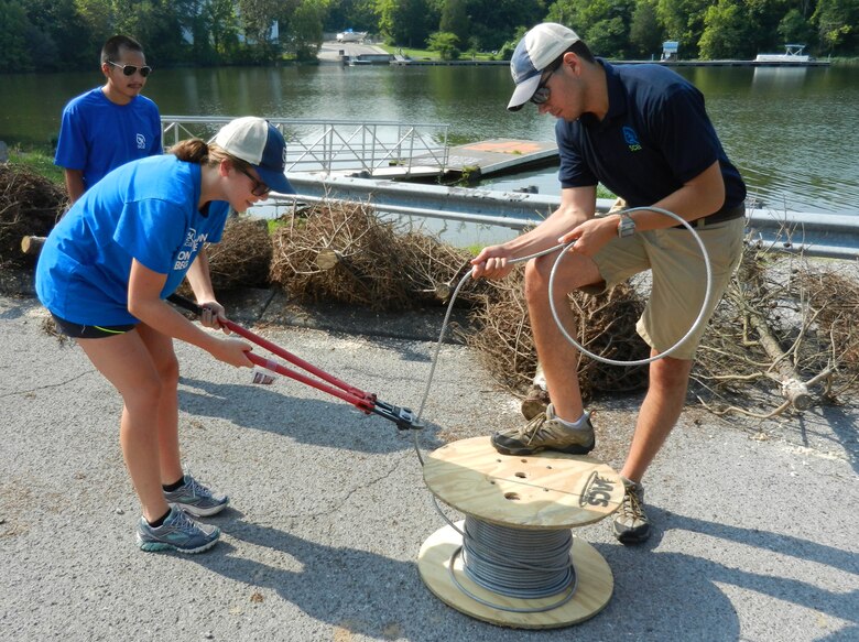 Student Conservation Association team member’s (left to right) Roy Cazares, Erica Nicolay, and Darrel Thompson cut cable for the new fish attractors on Old Hickory Lake near Lone Branch Recreation Area in Mt. Juliet, Tenn., Aug. 27, 2013.