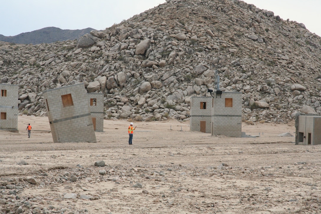 Justin Gay, a project manager with the U.S. Army Corps of Engineers, Los Angeles districts’ Fort Irwin Resident Engineer office assess damages at the “Medina Jabal” training area.  