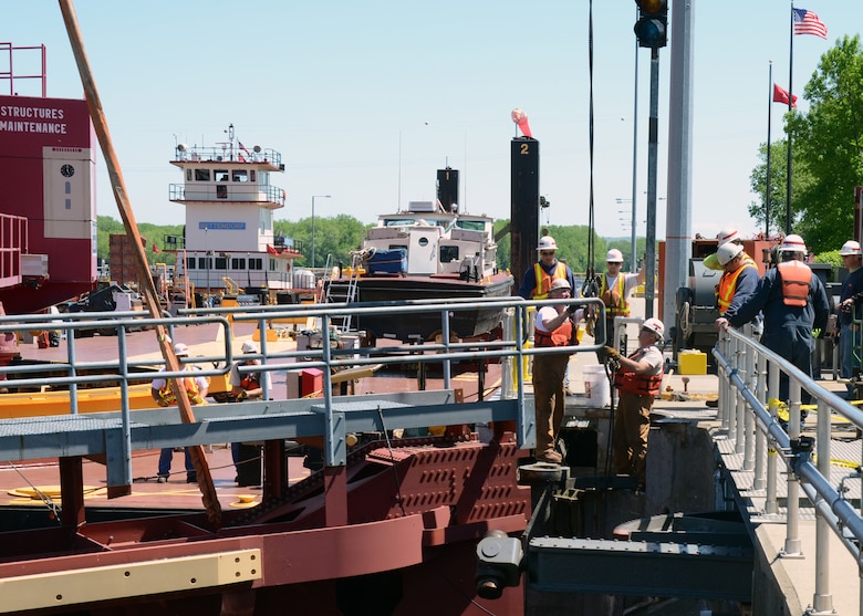 MINNESOTA CITY, Minn. -- Crew members from St. Paul and Rock Islands districts install a temporary gate at Lock and Dam 5A,near Minnesota City, Minn., May 23.