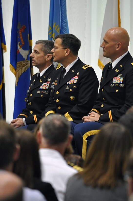 ST. PAUL, Minn. -- Col. Michael Price, outgoing St. Paul District commander (left); Maj. Gen. John Peabody, Mississippi Valley Division commander; and Col. Daniel C. Koprowski, St. Paul District commander, listen to a speech during the change of command ceremony at the district headquarters in St.
Paul, Minn., June 19.