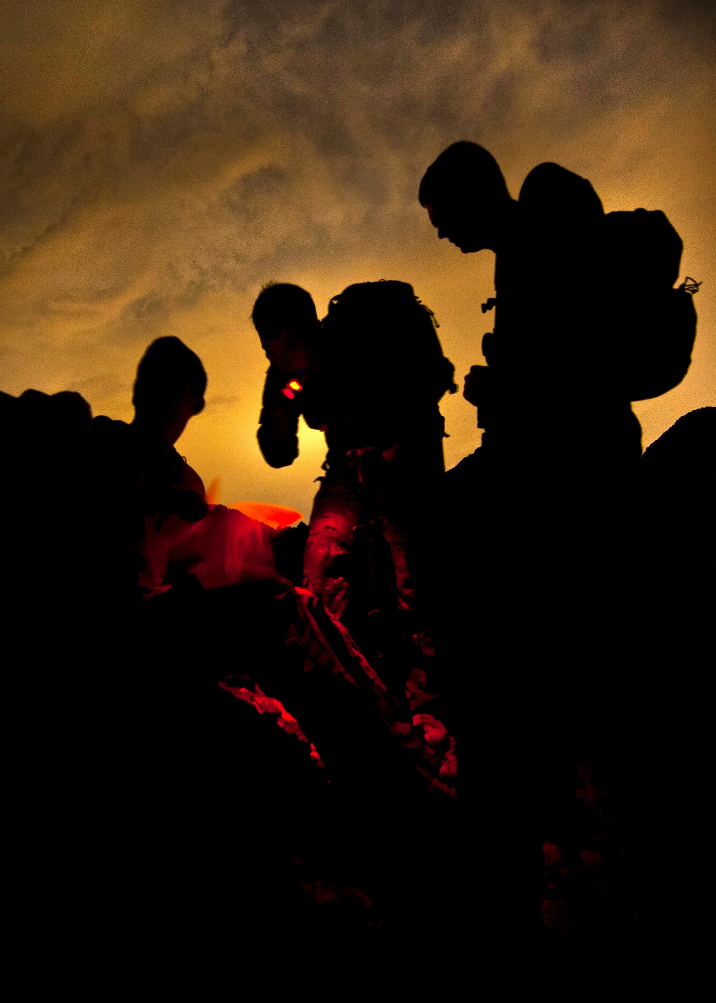 U.S. Air Force Airmen, 66th Rescue Squadron pilots and special missions aviators, prepare to establish coordinates on a map during a survival, evasion, resistance, escape familiarization training Aug. 23, 2013, at Area 2, Nellis Air Force Base, Nev. 
The training educates Airmen who have been determined to be at a high risk of isolation the methods used to survive in the arctic, desert, open ocean, jungle and mountain regions. (U.S. Air Force photo/Senior Airman Brett Clashman)
