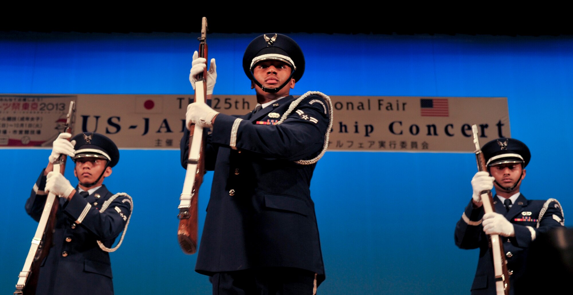 The Yokota Honor Guard drill team performs for an audience at the U.S. – Japan Friendship Concert Aug. 31, 2013, at Fussa, Japan.  The honor guard drill team is volunteer oriented and requires hours of additional training per week to perform effectively at events. (U.S. Air Force photo by Airman 1st Class Soo C. Kim)