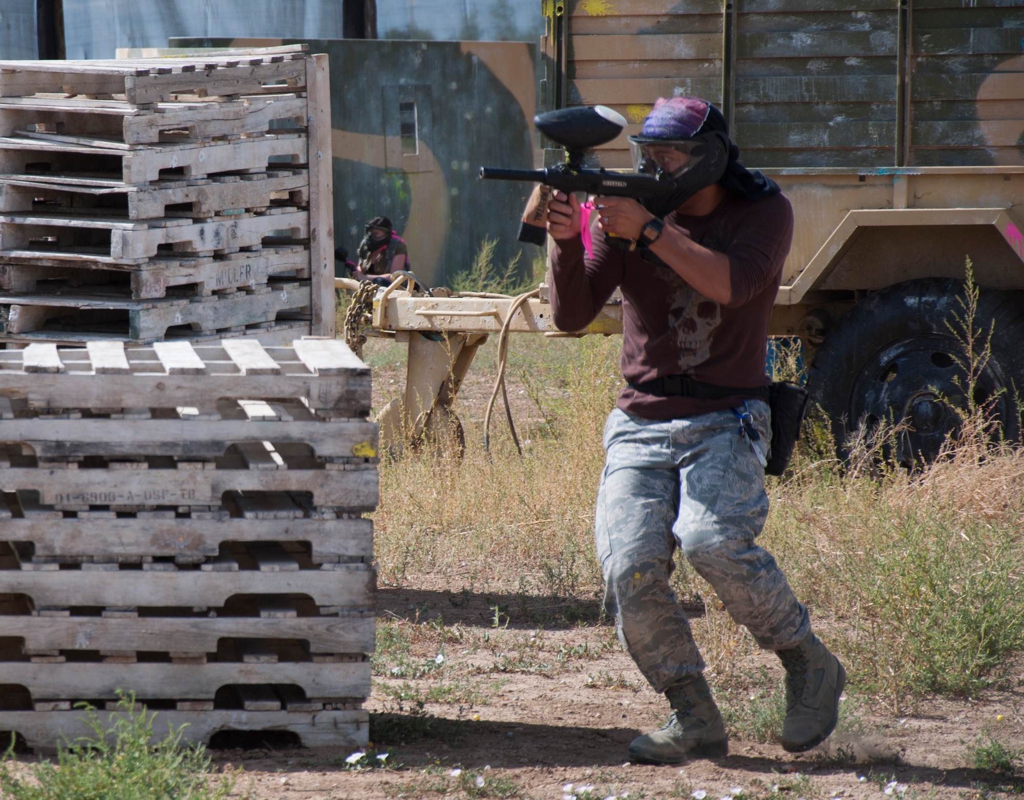 130831-F-GZ967-028 Senior Airman David Marshall, 90th Medical Operations Squadron, advances toward cover while laying suppression fire during a capture-the-flag paintball match on Aug. 31, 2013. Marshall was part of a group of Airman who traveled to Northern Colorado to paintball at one of the fields in Dacono, Colo. (U.S. Air Force photo by Airman 1st Class Brandon Valle)