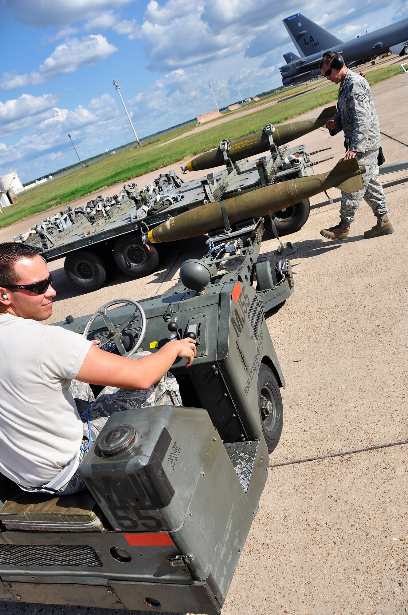 Senior Airman Anthony Alvarez, 482nd FW weapons loader, and Staff Sgt. Shane Compton, Detachment 93 weapons loader move a MK-82 bomb to an F-16 during Operation Green Flag. (U.S. Air Force photo/ Tech. Sgt. Lou Burton)