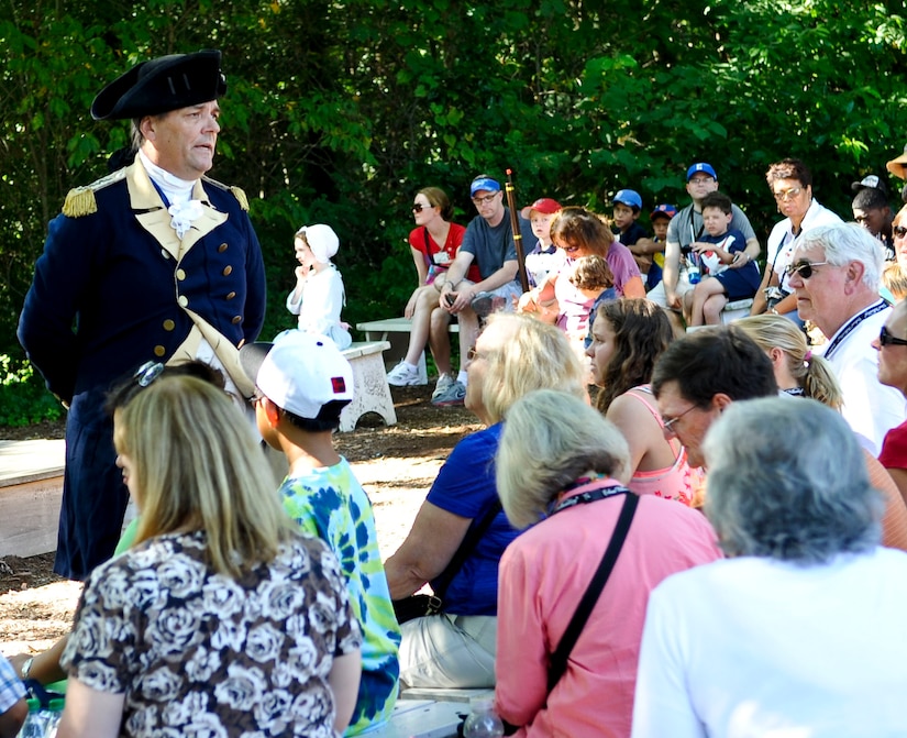 Visitors to Colonial Williamsburg attend a question and answer session with an actor portraying Gen. George Washington, Aug. 26, 2013 in Williamsburg, Va. Colonial Williamsburg offers visitors a look back in time with actors dressed in period clothing walking its streets daily. (U.S. Air Force photo by Staff Sgt. Wesley Farnsworth/Released)
