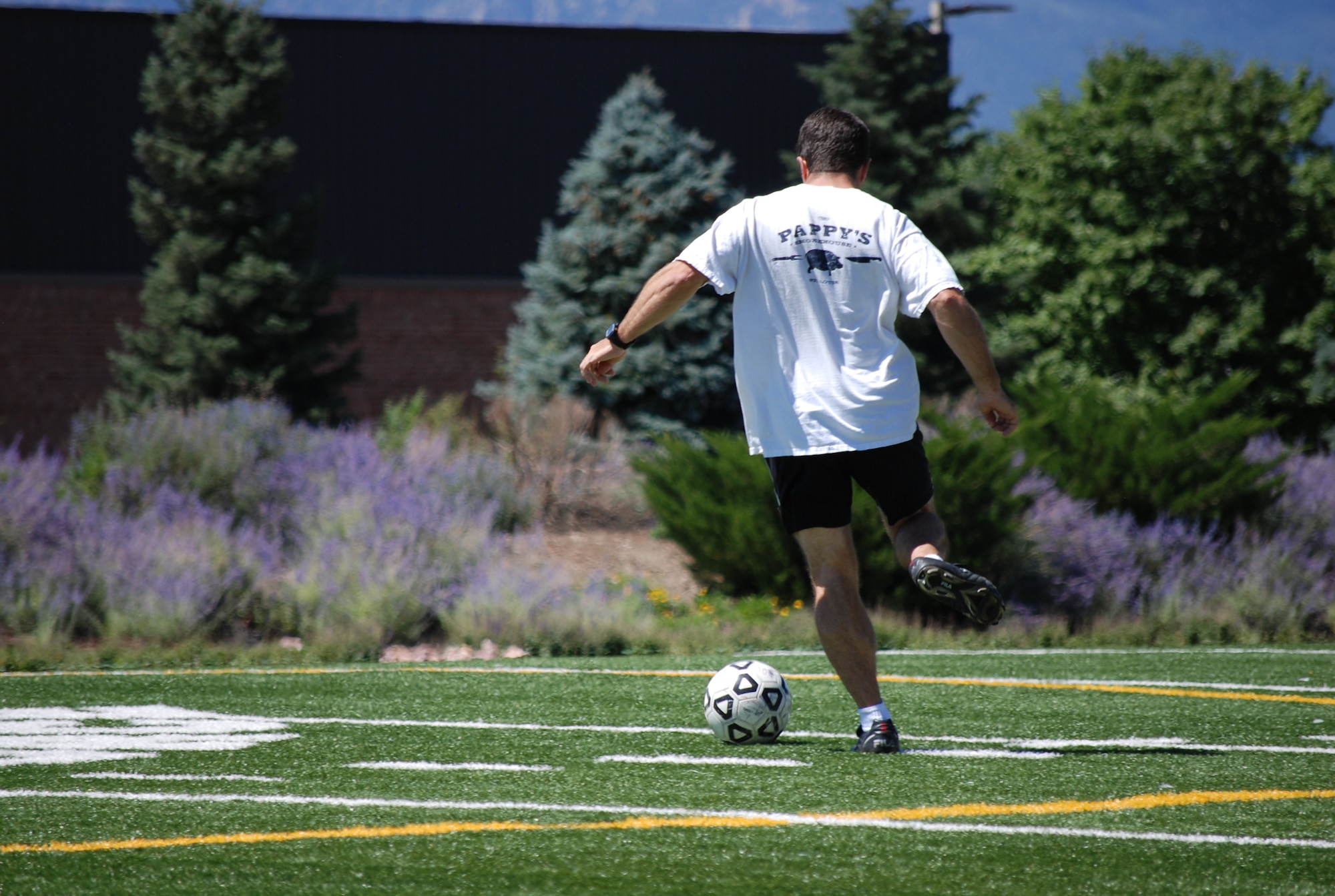 PETERSON AIR FORCE BASE, Colo. – Always room to improve, a team member from the intramural soccer league practices moving the ball down the field to prepare for next season. The Peterson fitness center organizes many intramural and extramural sports like softball, racquetball and soccer, among others. (U.S. Air Force photo/Michael Golembesky)