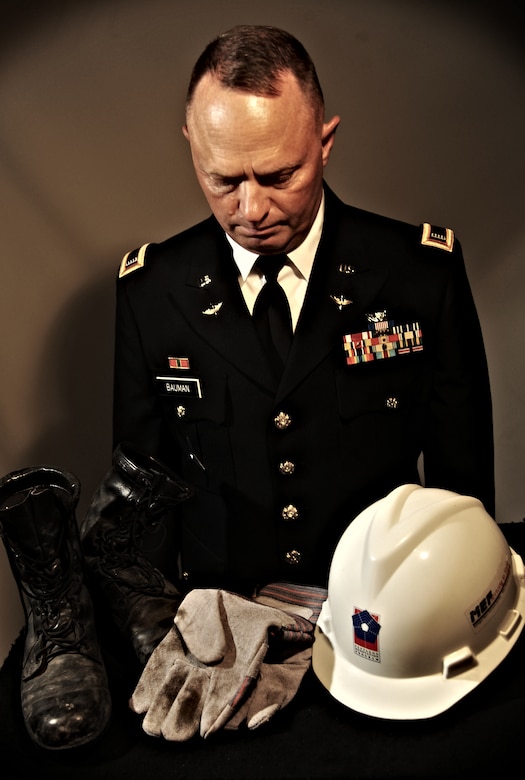 U.S. Army National Guard Chief Warrant Officer 4 Clifford Bauman, while at Langley Air Force Base, Va., Aug. 22, 2013, reflects on the boots, gloves and hat he wore during search and rescue missions at the Pentagon, Washington, D.C., after the Sept. 11, 2001 attacks. After the missions were over, Bauman placed the work gear in closet and did not touch them again until 12 years later. (U.S. Air Force photo illustration by Staff Sgt. Jarad A. Denton/Released)