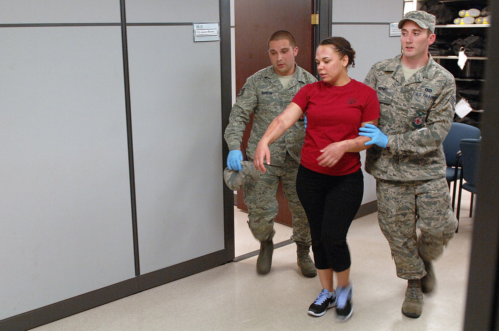 U.S. Air Force Staff Sgts. Anthony Barton and Shane Rounds, 4th Civil Engineer Squadron firefighters, evacuate a victim during an active shooter exercise at Seymour Johnson Air Force Base, N.C., Aug. 24, 2013.  Readiness exercises are conducted to streamline unit cohesion when responding to emergencies.  (U.S. Air Force photo by Airman 1st Class Brittain Crolley/Released)