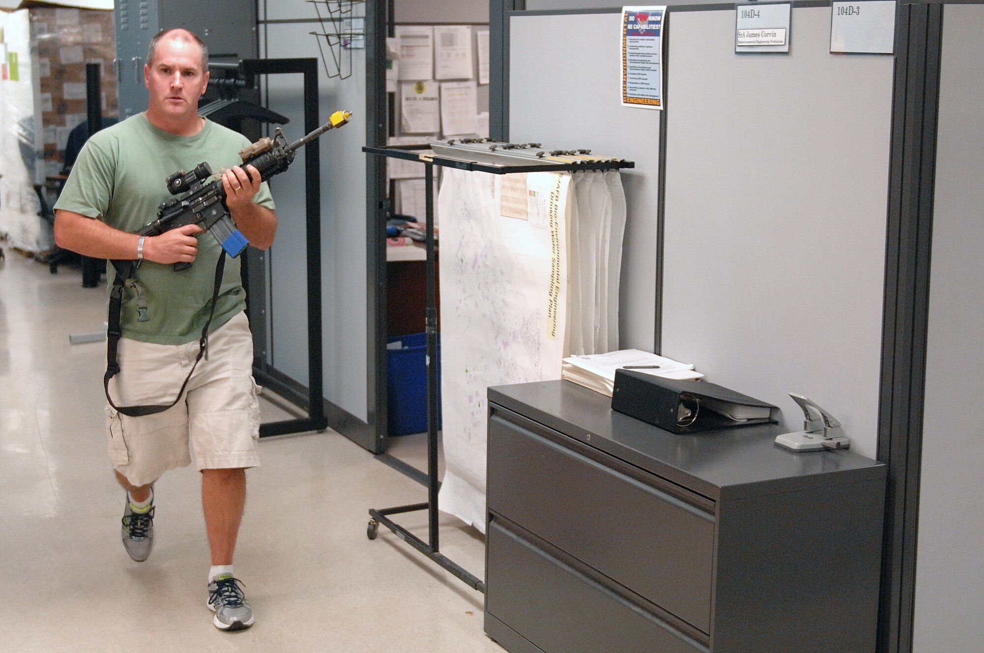 U.S. Air Force Chief Master Sgt. Thomas Trottier, 4th Medical Group superintendent, plays the role of a disgruntled Airman during an active shooter exercise at Seymour Johnson Air Force Base, N.C., Aug. 24, 2013.  The 4th Fighter Wing routinely conducts readiness exercises to test and enhance Airmen’s skills and proficiency.  (U.S. Air Force photo by Airman 1st Class Brittain Crolley/Released)