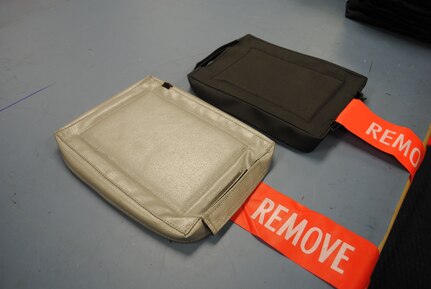 12th Flying Training Wing T-38C maintainers and the 12th Operations Support Squadron’s Aircrew Flight Equipment Survival Office tested multiple prototypes for multi-function display covers before deciding on a final design (pictured on right).  The covers are sewn together by a team of three AFE Survival technicians working as an assembly line, using industrial foam and the same fabric used for convertible car tops.  (U.S. Air Force photo/Bekah Clark)