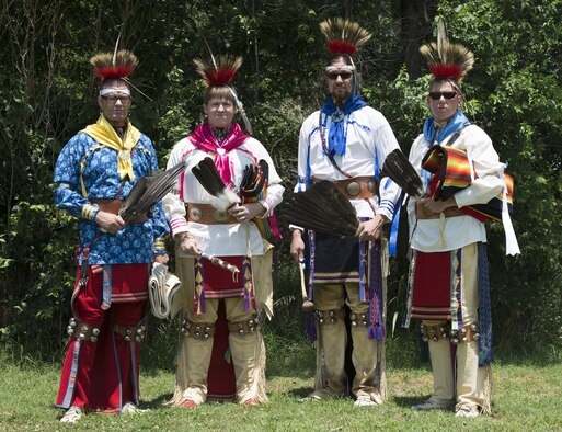 Osage Nation relatives of Maj. Gen. Clarence L. Tinker, dressed in native attire, sing and dance to a song written to Tinker during their annual four day celebration called In-lon-shka held in Pawhuska Indian Village, Okla., June 30, 2013. Tinker was the highest ranking officer of Native-American ancestry and the first general lost in action during World War II. (U.S. Air Force photo/Desiree N. Palacios)