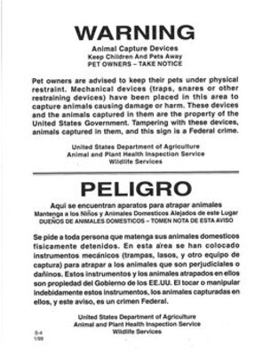 Coyote trap warning sign