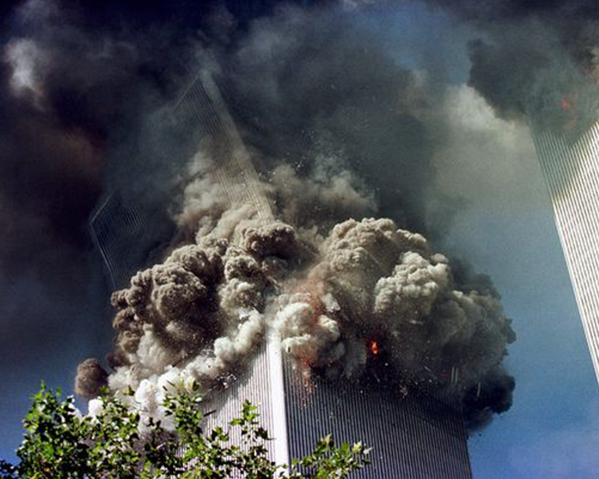The World Trade Center’s South Tower collapses at 9:59 a.m., Sept. 11, 2001. The collapse caused flaming debris and rubble to crash down on the New York City streets below. (Getty Images photo by Thomas Nilsson/Released)