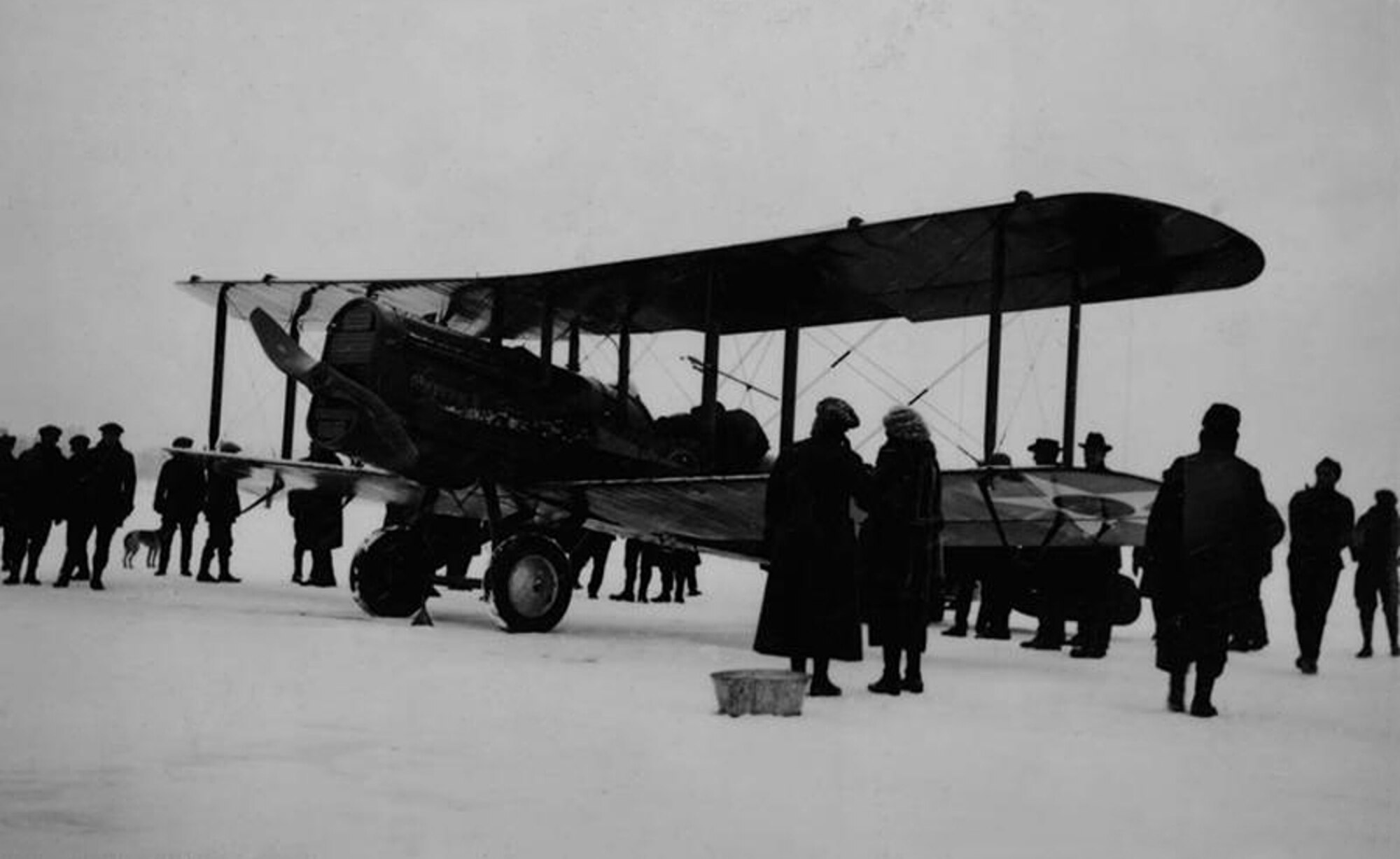 A De Havilland DH-4 sits on the ice on Lake Charlevoix prior to a flight to Beaver Island on Feb. 7, 1923. The military aircraft flew from Selfridge Field, near Detroit, to pick up a doctor and then make the short flight to Beaver Island in Lake Michigan as part of a rescue mission. The pilot was Capt. Russell L. “Luff” Meredith. At the time, Meredith was assigned to the First Pursuit Group, then stationed at Selfridge. The flight resulted in the first of only two Distinguished Flying Cross believed to have been awarded for flights that took place solely in the state of Michigan. (Photo courtesy of the Charlevoix Historical Society)