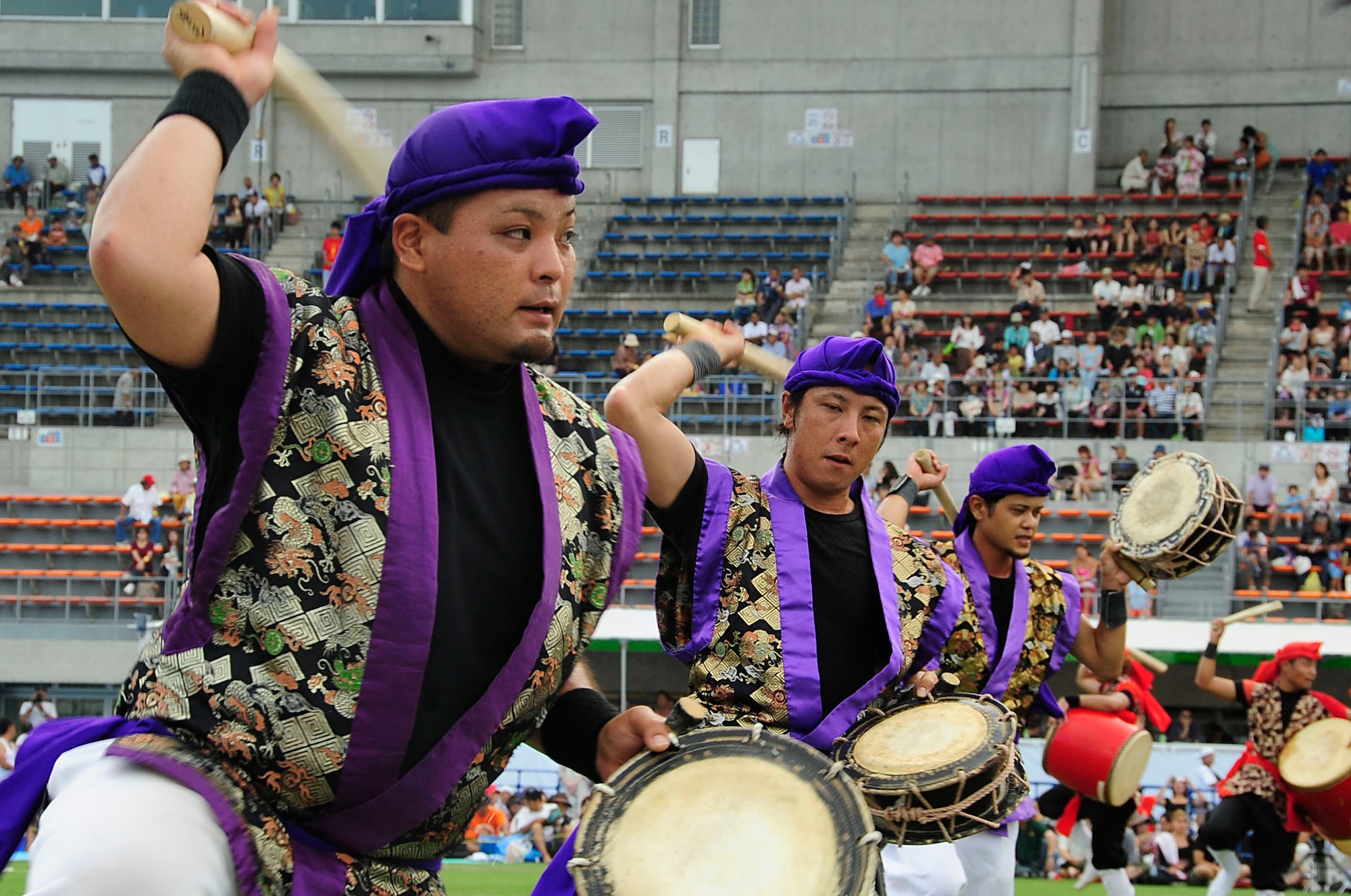 A Taiko drum group performs for the crowd during the 58th Okinawa Zento Eisa Festival in Koza Athletic Park Aug. 31, 2013. This island-wide event is the largest of its kind in Okinawa and lasts for three days. (U.S. Air Force photo by Staff Sgt. Darnell T. Cannady)