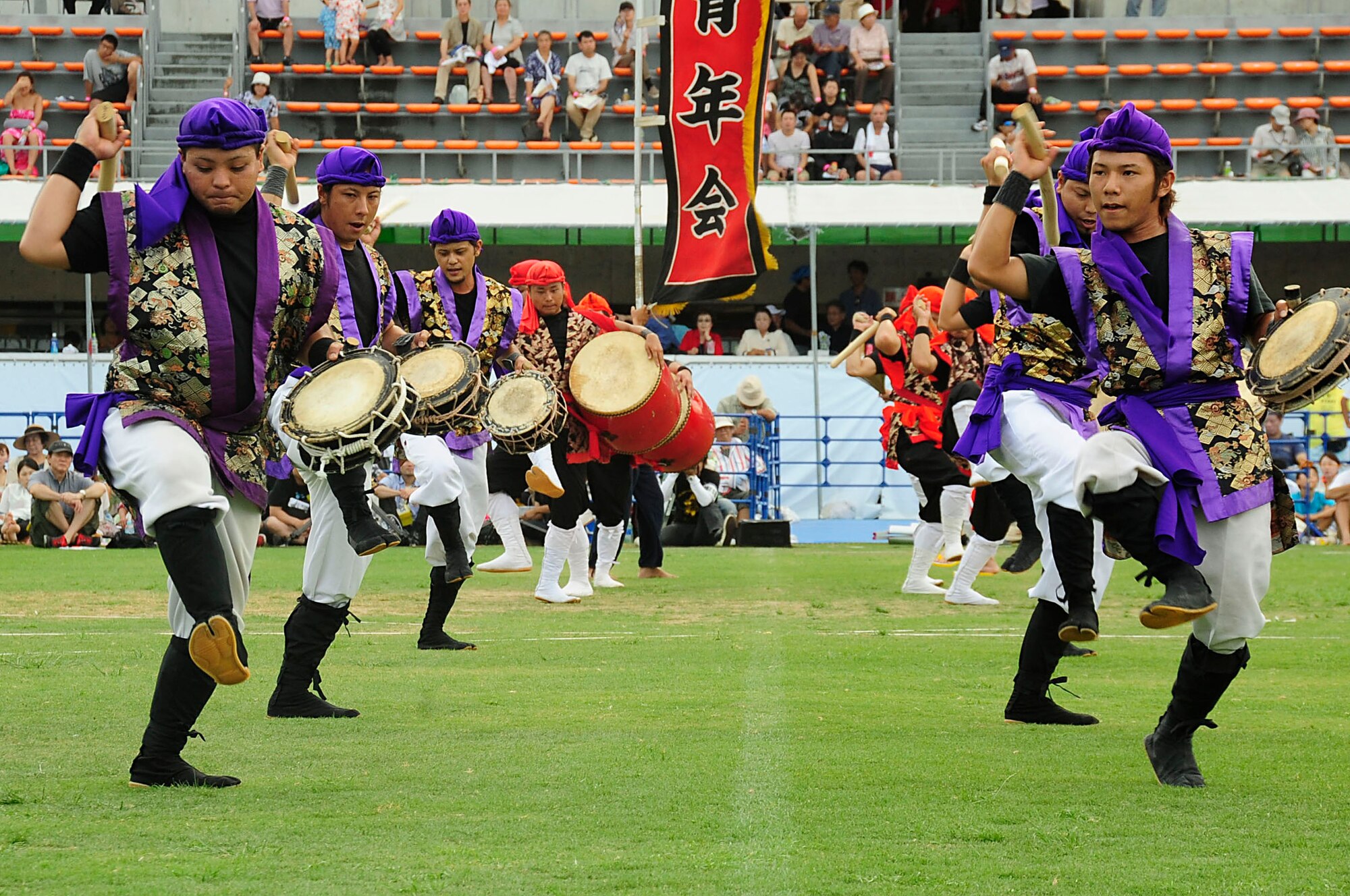 A Taiko drum group performs for the crowd during the 58th Okinawa Zento Eisa Festival in Koza Athletic Park Aug. 31, 2013. Different youth groups performed for the crowd during the second day of the three-day island-wide event. (U.S. Air Force photo by Staff Sgt. Darnell T. Cannady)
