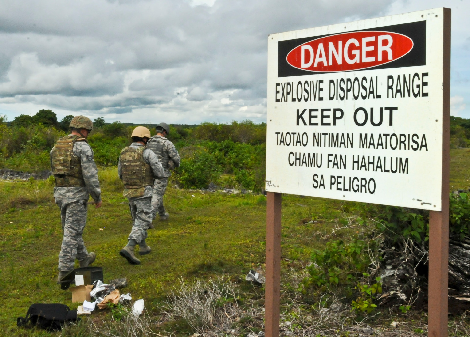 Airmen from the 36th Civil Engineer Squadron Explosive Ordnance Disposal flight train Airmen from the 36th Civil Engineer Emergency Management flight to use ground burst simulators, Aug. 26, 2013, on Andersen Air Force Base, Guam. The training gave the Airmen the necessary knowledge to utilize the GBS correctly and safely. (U.S. Air Force photo by Airman 1st Class Amanda Morris/Released)