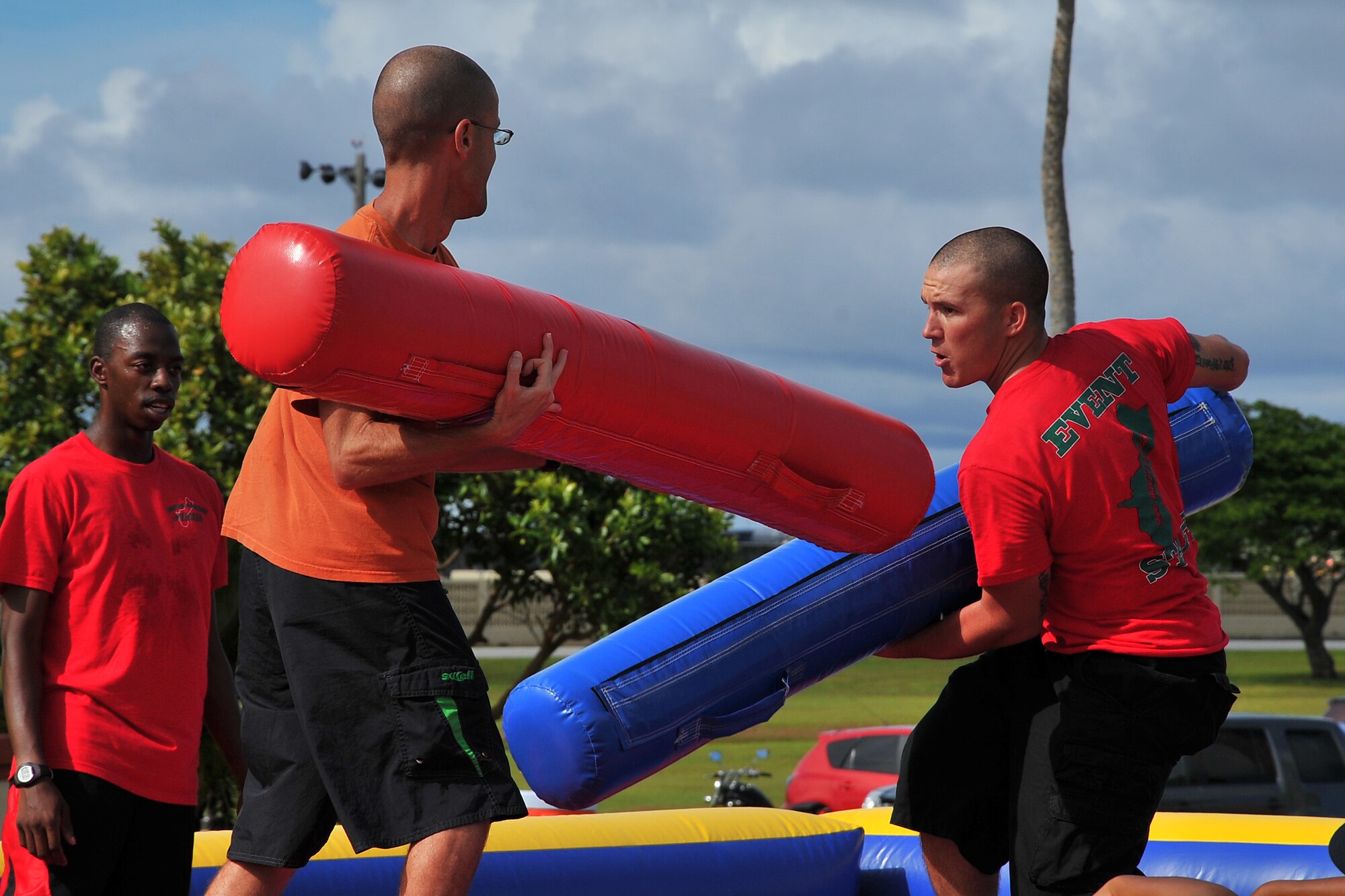 Master Sgt. Garrett Toomas, 36th Wing Command Post, and Army Spc. Matthew Harris, 94th Army Air and Missile Defense Command, participate in the Last Man Standing contest during the Labor Day Bash Aug. 30, 2013, on Andersen Air Force Base, Guam. More than 200 military members and their families attended the event which was held at the Arc Light Memorial Park. (U.S. Air Force photo/Staff Sgt. Melissa B. White/Released)
