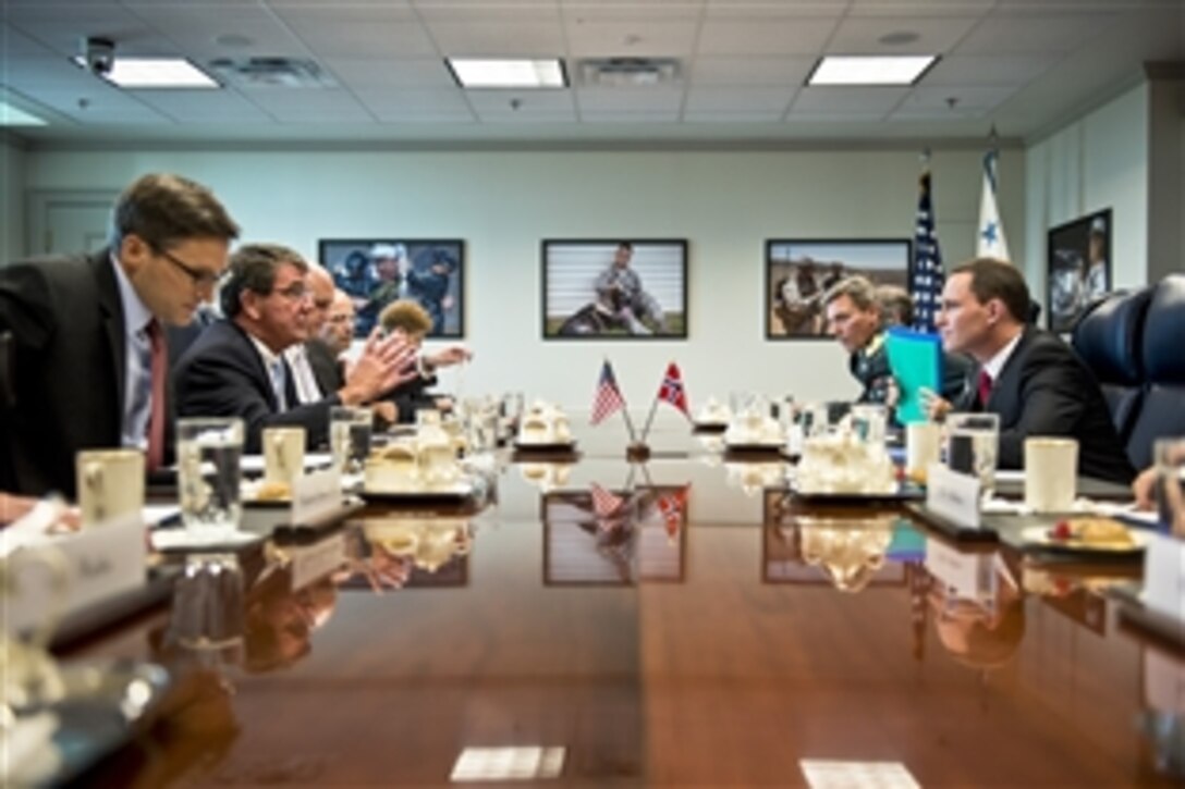 U.S. Deputy Defense Secretary Ash Carter, second from left, meets with Eirik Owre Thorshaug, right, Norway's state secretary, a position within the country's defense ministry, at the Pentagon, Sept. 3, 2013. The two leaders discussed issues of mutual importance.