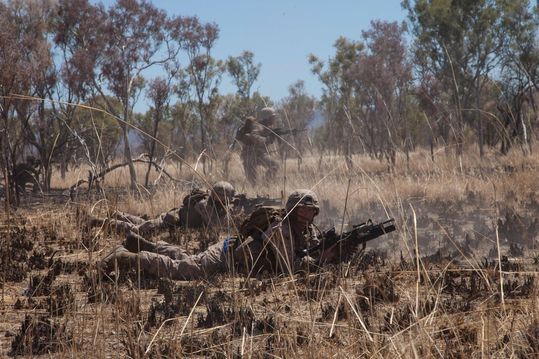 Marines with Company E., Battalion Landing Team 2nd Battalion, 4th Marines, 31st Marine Expeditionary Unit, bound forward during a combined, live-fire exercise for Exercise Koolendong 13 here, Sept. 3. The 31st MEU moved a battalion-sized force more than 300 miles inland from the Port of Darwin to conduct training. The exercise demonstrates the operational reach of the 31st MEU. Also participating in the exercise is the Marine Rotational Force – Darwin and soldiers of the 5th Royal Australian Regiment. The 31st MEU brings what it needs to sustain itself to accomplish the mission or to pave the way for follow-on forces. The 31st MEU is the Marine Corps' force in readiness for the Asia-Pacific region and the only continuously forward-deployed MEU. 