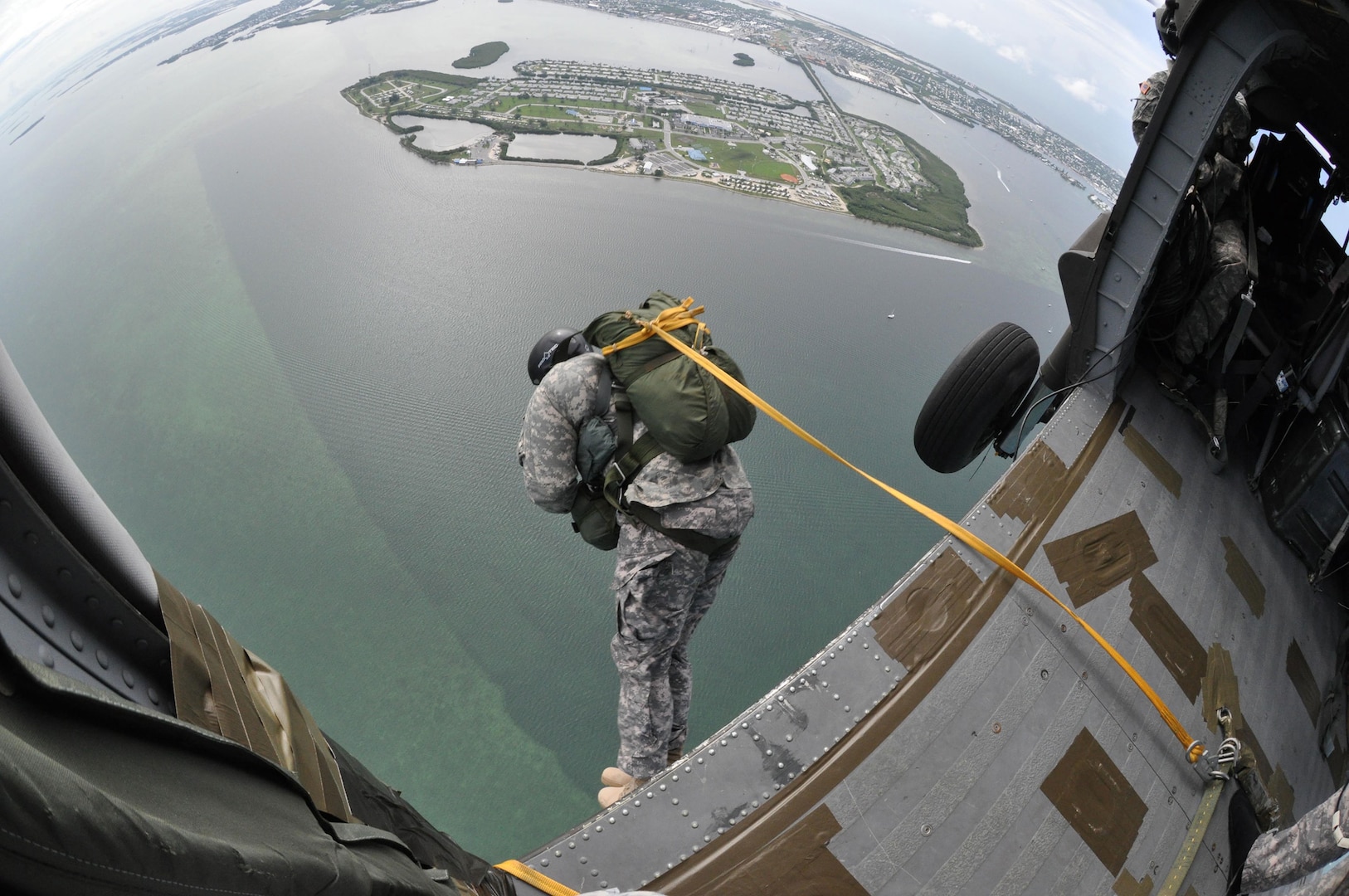 A member of the Florida Army National Guard's Charlie Company, 3rd Battalion, 20th Special Forces Group, exits a UH-60 Black Hawk helicopter during an airborne training exercise in Key West, Fla., Sept. 27, 2012.