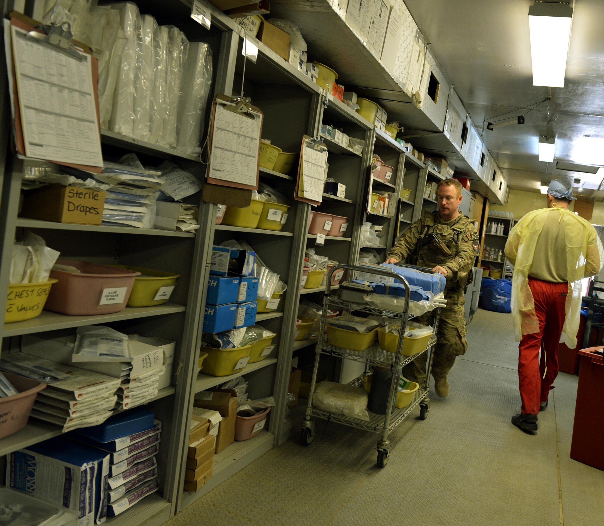 Maj. Jared Mort, Foward Surgical Team chief nurse, sets up the Emergency Room with supplies and equipment for an incoming patient on Forward Operating Base Ghazni, August 25, 2013. Mort is in charge of managing the nursing services to include triage, making schedules, ensuring equipment works and that everyone is in the right place at the right time to provide the best care that they can. He is deployed from Keesler Air Force Base, Miss.