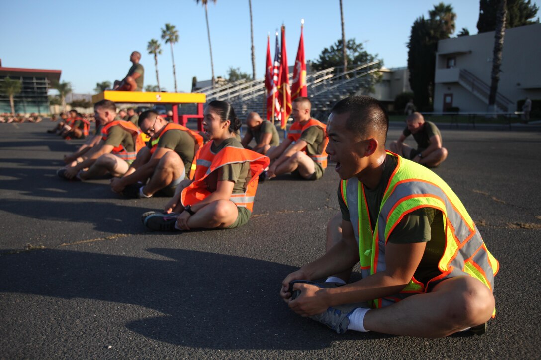 Marines with Combat Logistics Regiment 15, 1st Marine Logistics Group, stretch after completing a motivational run aboard Camp Pendleton, Calif., Aug. 29, 2013. Hundreds of Marines and sailors echoed through the streets as they shouted cadences during the run. The run was held to boost morale and camaraderie throughout the regiment. 