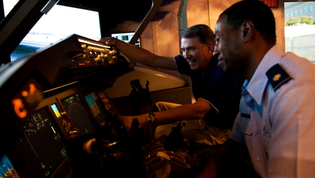 Maj. Damen Forte (right), who's been aircrew on the KC-135 Stratotanker and the C-17 Globemaster III, is at the controls to the Air Force's newest tanker, the KC-46, with Greg Bulkley, chief technical pilot for Boeing's KC-46. 