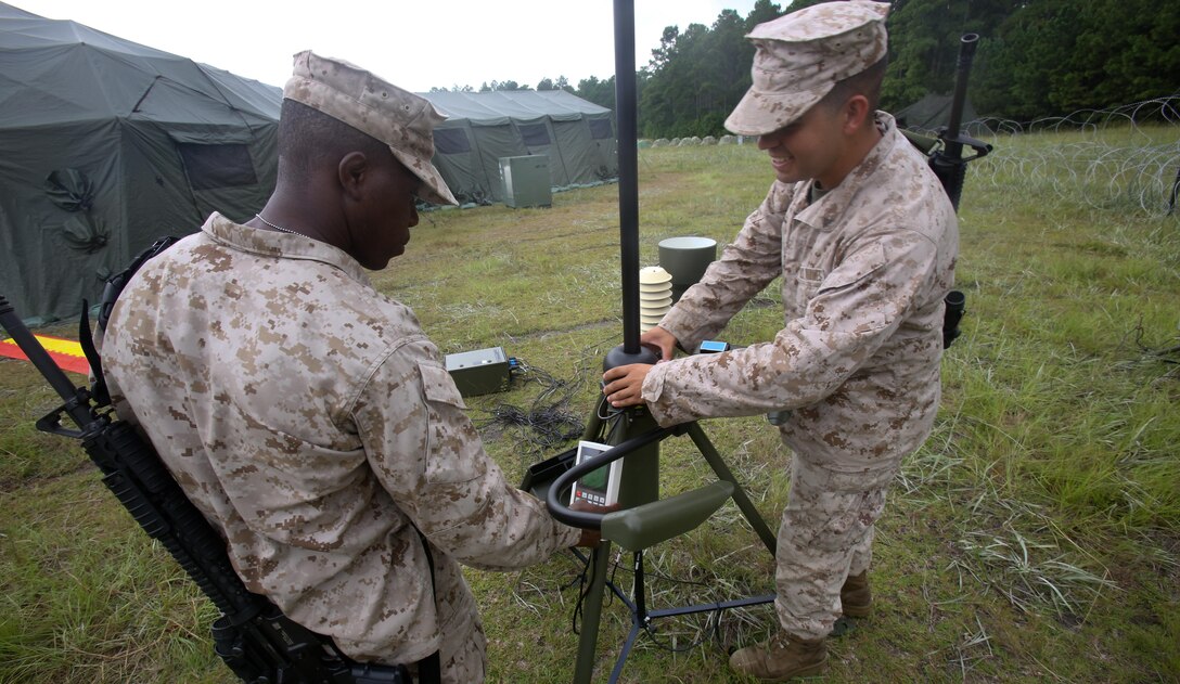 Marines participating in the 2nd Intelligence Battalion, II Marine Expeditionary Force, Basic Intelligence Training Course perform basic functions checks on a signal device aboard Camp Lejeune, August 14. Marines performed a variety of skills and tasks that helped simulate a deployment style scenario during the exercise.
