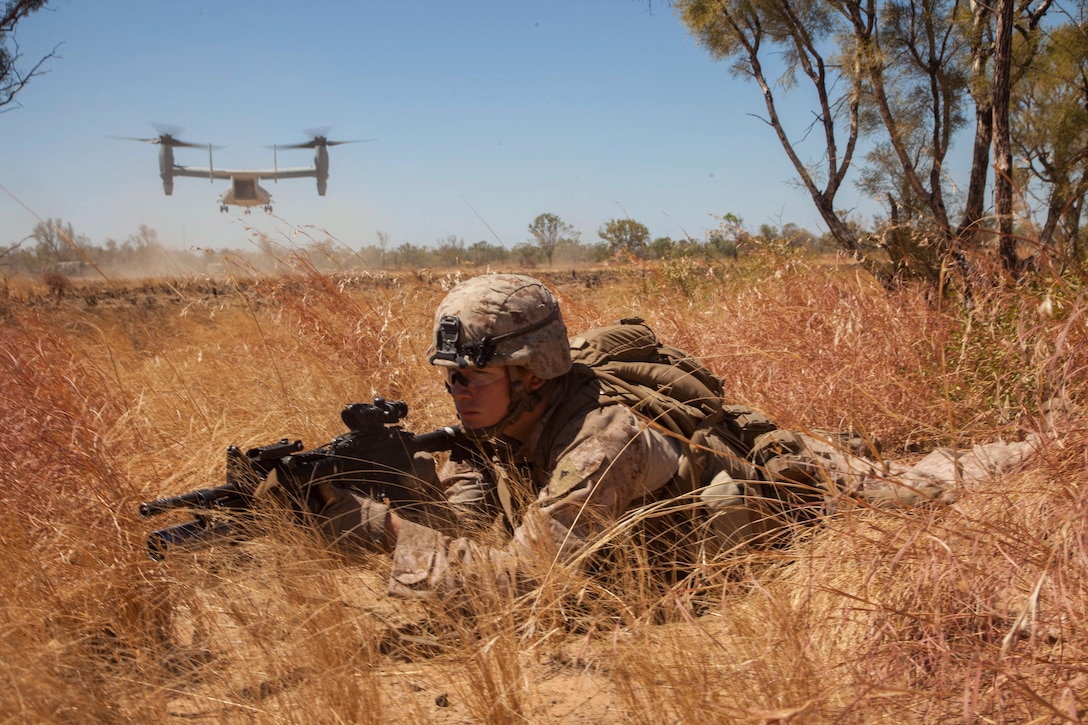 Lance Cpl. John Ready, an M27 Infantry Automatic Rifle gunner for Company E., Battalion Landing Team 2nd Battalion, 4th Marines, 31st Marines Expeditionary Unit, provides security as an MV-22 Osprey from Marine Medium Tiltrotor Squadron 265 (Reinforced), 31st MEU, takes off after inserting a platoon of Marines during an integrated, live-fire exercise for Exercise Koolendong 13 here, Sept. 3. The 31st MEU moved a battalion-sized force more than 300 miles inland to conduct the training. The exercise demonstrates the operational reach of the 31st MEU and reinforces why the 31st MEU is the force of choice for the Asia-Pacific region. Also participating in the exercise is the Marine Rotational Force – Darwin and soldiers of the 5th Royal Australian Army. The 31st MEU brings what it needs to sustain itself to accomplish the mission or to pave the way for follow-on forces. 