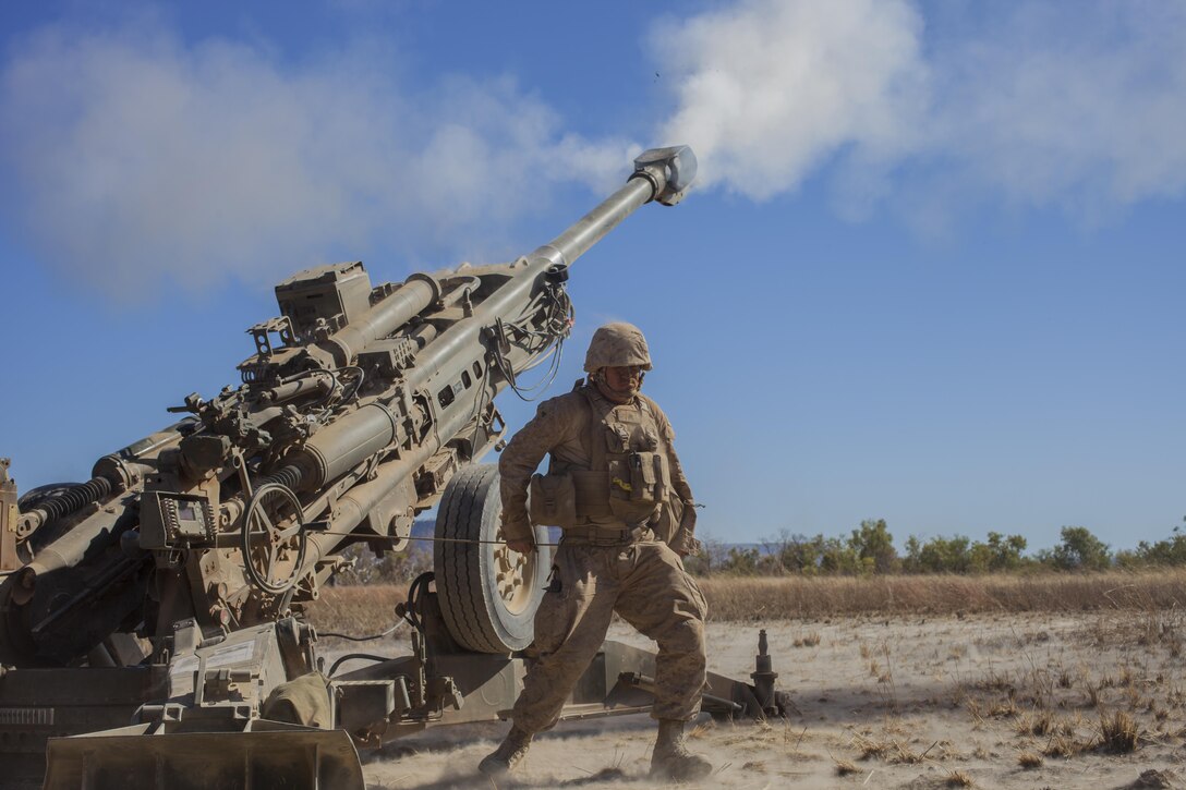 A Marine with Weapons Co., Battalion Landing Team 2nd Battalion, 4th Marines, 31st Marines Expeditionary Unit, fires the M777A2 Lightweight Howitzer during an integrated, live-fire exercise for Exercise Koolendong 13 here, Sept. 3. The 31st MEU moved a battalion-sized force more than 300 miles inland to conduct the training. The exercise demonstrates the operational reach of the 31st MEU and reinforces why the 31st MEU is the force of choice for the Asia-Pacific region. Also participating in the exercise is the Marine Rotational Force – Darwin and soldiers of the 5th Royal Australian Army. The 31st MEU brings what it needs to sustain itself to accomplish the mission or to pave the way for follow-on forces.