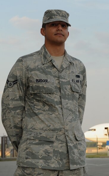 Airman 1st Class Timothy Pledger, 20th Aircraft Maintenance Unit electronic warfare journeyman, poses for a photo on Barksdale Air Force Base, La., Aug. 30, 2013. Pledger was supposed to deploy to Anderson Air Force Base, Guam, early in the morning, but an aircraft malfunction delayed the departure. While spending what little time he had left with his wife, her water broke. Unable to wait for an ambulance, Pledger successfully delivered his daughter while listening to directions over the phone from emergency personnel. (U.S. Air Force photo/Senior Airman Benjamin Gonsier)