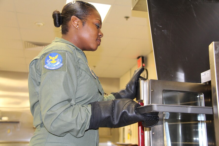 Tech. Sgt. Monica Codner, a flight attendant with the 73rd Airlift Squadron prepares meals for an upcoming trip. During a 932nd Airlift Wing mission, Codner flies national leaders, both military and civilian, around the world, safeguarding her passengers, while also providing exceptional meals and ensuring comfort in flight. She is part of the 73rd AS based at Scott Air Force Base.  (U.S. Air Force photo/Staff Sgt. Meiko Schill)