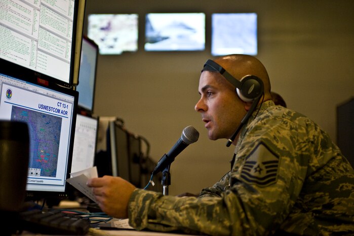 Master Sgt. Charles Shurchay, 505th Test Squadron superintendent, announces a downed aircraft during a continuation training exercise involving 505th TS members Aug. 28, 2013, at Nellis Air Force Base, Nev. The 505th TS provides advanced operational level training using a combination of live, virtual, and constructive exercises such as Red Flag and Virtual Flag. (U.S. Air Force photo by Airman 1st Class Christopher Tam)
