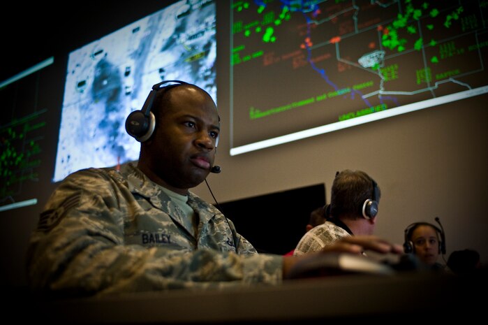 Staff Sgt. Quenton Bailey, 505th Test Squadron interface control technician, inputs the location of a downed aircraft point during a continuation training exercise Aug. 28, 2013, at Nellis Air Force Base, Nev. The 505th TS trains active- duty Air Force, joint, and coalition service members from various geographic and functional air operations centers across the world to maintain a combat mission ready status. (U.S. Air Force photo by Airman 1st Class Christopher Tam)