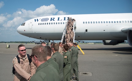 Members of the 17th Airlift Squadron are welcomed home by Joint Base Charleston leadership before reuniting with their families during the 17th AS redeployment Sept. 3, 2013, at Joint Base Charleston - Air Base, S.C. More than 100 Airmen from the 17th AS returned home from a deployment to Southwest Asia. Flying the C-17 Globemaster III, crews flew and supported roughly 790 sorties, logged more than 1,860 combat flying hours and airlifted more than 19.5 million pounds of cargo. (U.S. Air Force photo/Tech. Sgt. Rasheen Douglas)