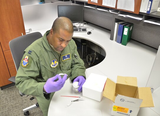 WRIGHT-PATTERSON AIR FORCE BASE, Ohio - Capt. Eric Powell, aerospace physiologist, Department of Aeromedical Research, U.S. Air Force School of Aerospace Medicine, Wright-Patterson Air Force Base, Ohio, experiments with live maggots for use in treating patients in the future. Maggot therapy is used sparingly, and is seen mostly with patients who have wounds that for whatever reason are not responding to conventional treatments and/or anti-biotics. (U.S. Air Force photo/Master Sgt. Charlie Miller)