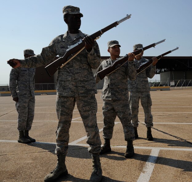 Airmen from the Honor Guard Bravo flight practice a three-volley salute on Barksdale Air Force Base, La., Sept. 4, 2013. Barksdale's Base Honor Guard covers a 53,000 square mile area ranging from Texas and Louisiana, covering events from funerals, posting and presenting of colors and retirements. (U.S. Air Force photo/Airman 1st Class Andrew Moua)
